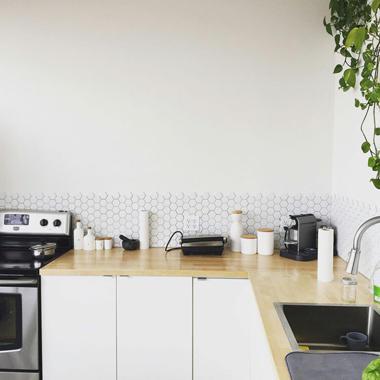 Kitchen scene showcasing the application of Topsen silicone sealant for sealing and waterproofing.